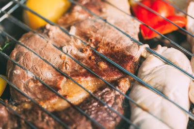 Close-up of meat on barbecue grill