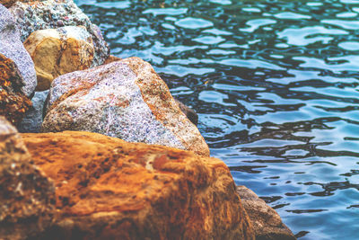 Close-up of rock in lake