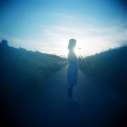 Full length of woman standing against clear sky