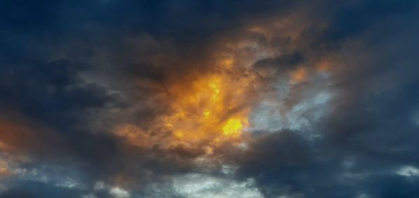 Low angle view of dramatic sky during sunset