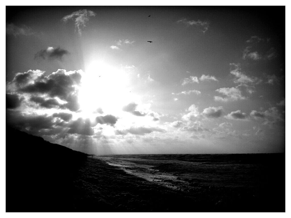 sea, transfer print, horizon over water, water, sky, scenics, tranquil scene, tranquility, beauty in nature, auto post production filter, beach, nature, sun, cloud - sky, idyllic, sunlight, shore, cloud, outdoors, sunbeam