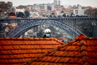 View of bridge in city against sky