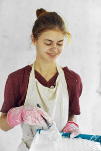 Portrait of young woman holding flower