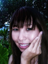 Close-up portrait of a smiling young woman