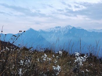 Scenic view of snowcapped mountains against sky