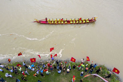 High angle view of people floating on river