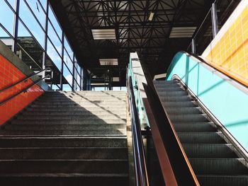 Low angle view of empty steps and escalator at railroad station