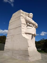 Low angle view of statue against sky