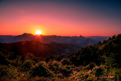 Scenic view of mountains against sky during sunset