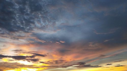 Low angle view of dramatic sky during sunset