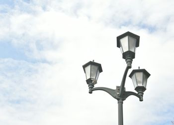 Low angle view of street light against sky