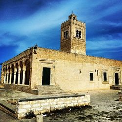 Low angle view of built structure against blue sky