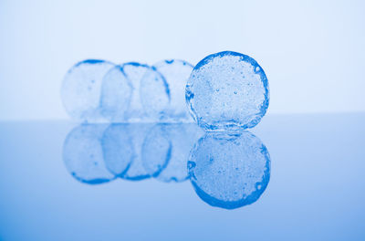 Close-up of bubbles on white background