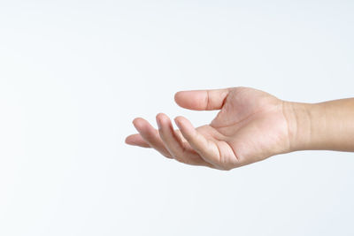 Close-up of hand against white background