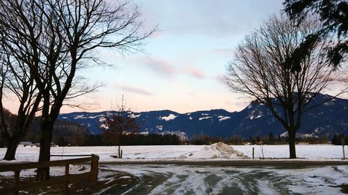 Scenic view of lake against sky during winter