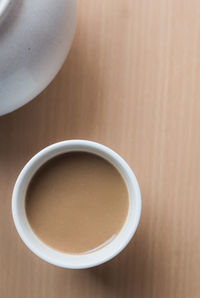 Close-up high angle view of coffee cup on table
