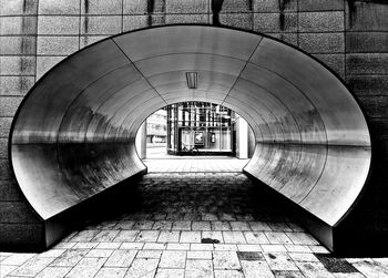 Empty footpath in tunnel