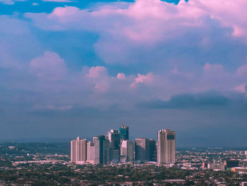 Buildings in city against sky