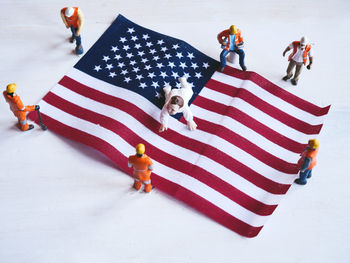 High angle view of people standing on flag