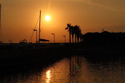 Silhouette of marina at sunset