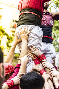 Rear view of couple holding hands