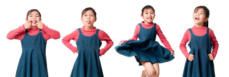 Low section of women standing against white background