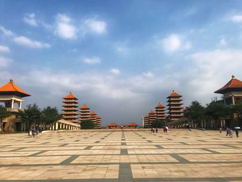 View of historical buildings against cloudy sky