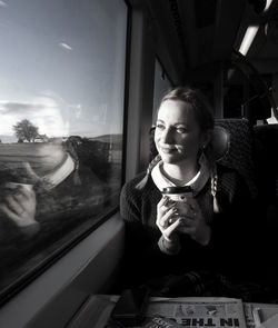 Portrait of young woman in car