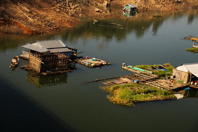 High angle view of floating houses in river