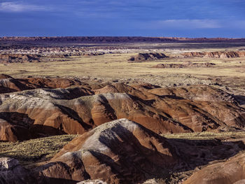 Aerial view of rock formations on landscape against sky