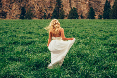 Full length of woman on grassy field