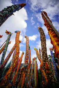 Low angle view of cross against sky