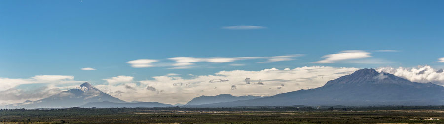 Scenic view of landscape and mountains against sky