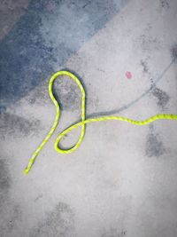 High angle view of yellow umbrella on street