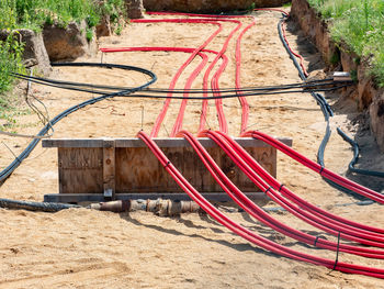 Large cables with strong electrical insulation lay underground near the distribution building