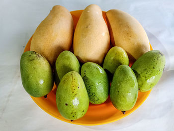 High angle view of fruits in bowl on table