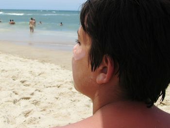 Close-up of young woman on beach