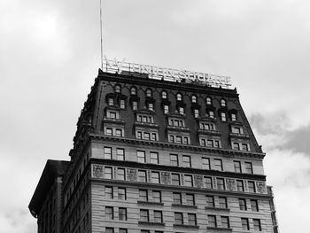 Low angle view of apartment building against sky