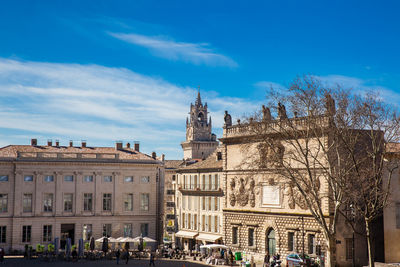 Low angle view of buildings against blue sky