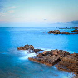 Scenic view of sea against clear sky