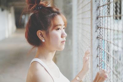 Portrait of young woman looking away