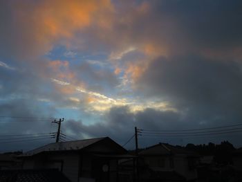 Low angle view of buildings against sky at dusk