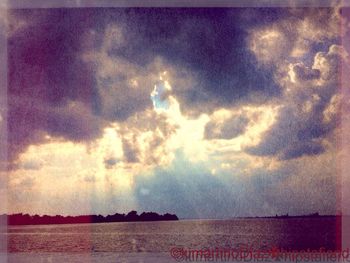 Scenic view of landscape against cloudy sky