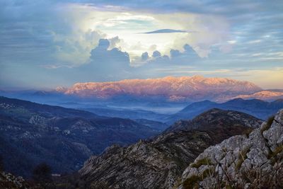 Scenic view of mountains against sky during sunset