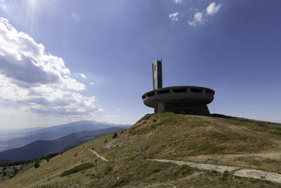 Low angle view of castle on mountain against sky