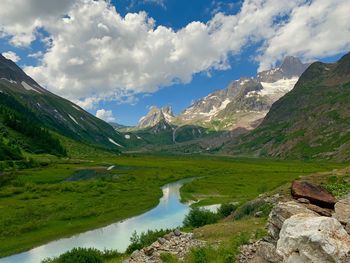 Scenic view of lake and mountains against sky