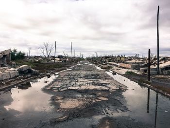 Reflection of sky in puddle