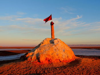 Scenic view of beach against sky during sunset