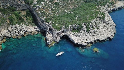 High angle view of rocks by sea