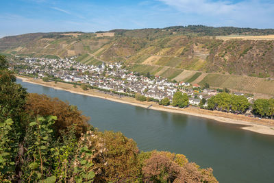 High angle view of river and cityscape against sky